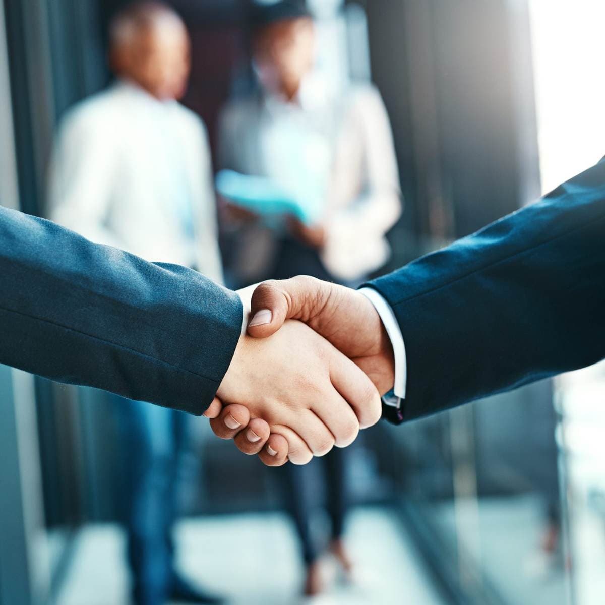 Business handshake over car deal